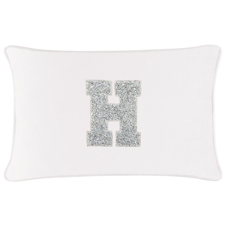 White velvet rectangular pillow featuring a rhinestone-embellished letter "H" in silver.
