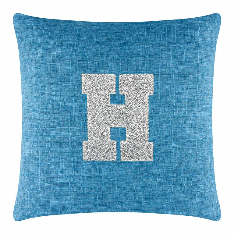 Aqua textured pillow with a large silver rhinestone monogram "H" in the center featuring a soft plush appearance.