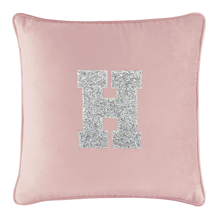 Blush&#x20;velvet&#x20;pillow&#x20;with&#x20;a&#x20;large&#x20;silver&#x20;rhinestone&#x20;letter&#x20;&quot;H&quot;&#x20;in&#x20;the&#x20;center&#x20;and&#x20;a&#x20;soft&#x20;plush&#x20;texture.