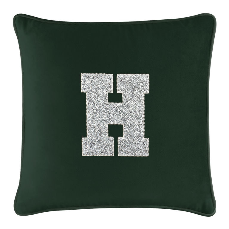 Emerald velvet pillow featuring a large silver rhinestone monogram letter "H" in the center.