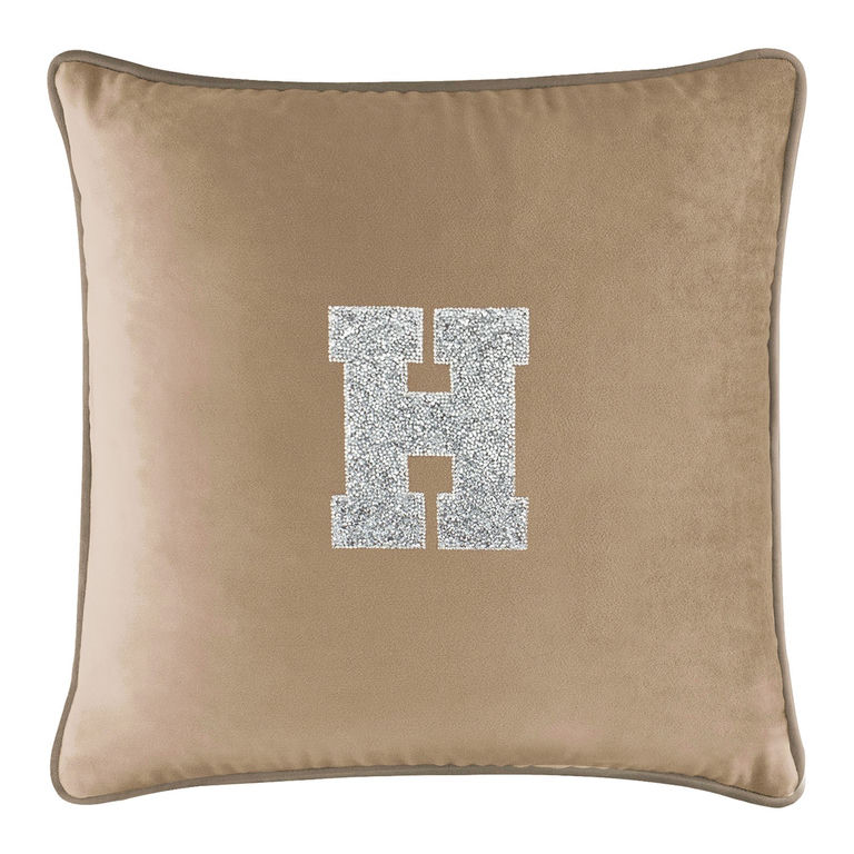 Champagne&#x20;velvet&#x20;pillow&#x20;with&#x20;a&#x20;large&#x20;rhinestone-embellished&#x20;letter&#x20;&quot;H&quot;&#x20;in&#x20;silver&#x20;on&#x20;the&#x20;front&#x20;featuring&#x20;a&#x20;soft&#x20;plush&#x20;texture.