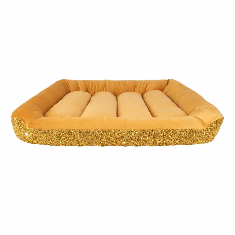 Large pet bed with a plush golden velvet surface featuring a quilted design and rounded edges.