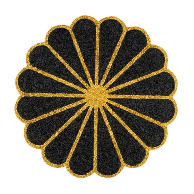 Round placemat featuring a black textured surface with gold rhinestone trim and a central gold burst design.