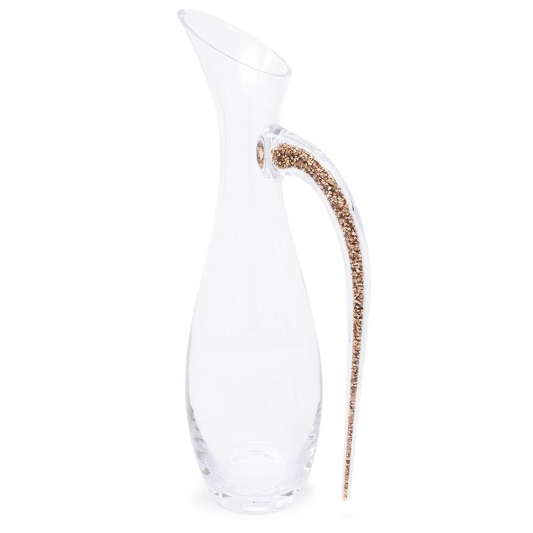 Clear crystal glass decanter with a curved spout and a handle featuring a rhinestone-filled design.