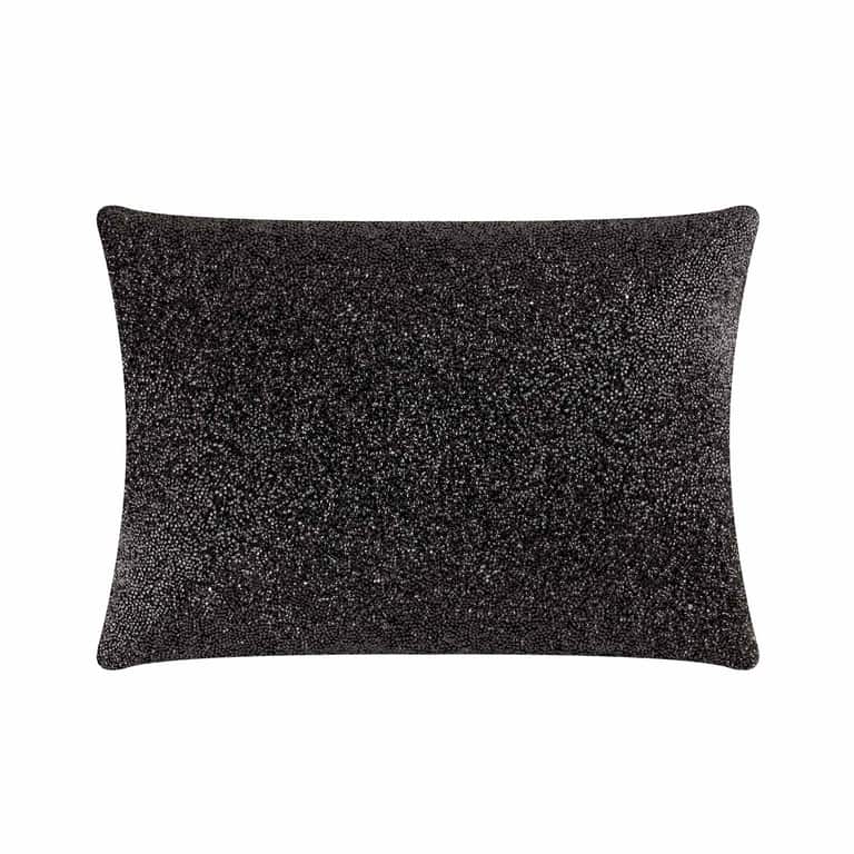 Black rectangular pillow with a textured surface fully adorned with small rhinestones soft velvet backing and plush fill.