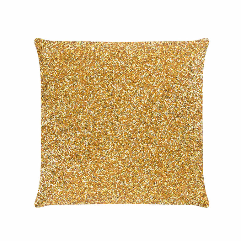 Square pillow covered in gold rhinestones with a soft velvet back featuring a textured surface and plush filling.