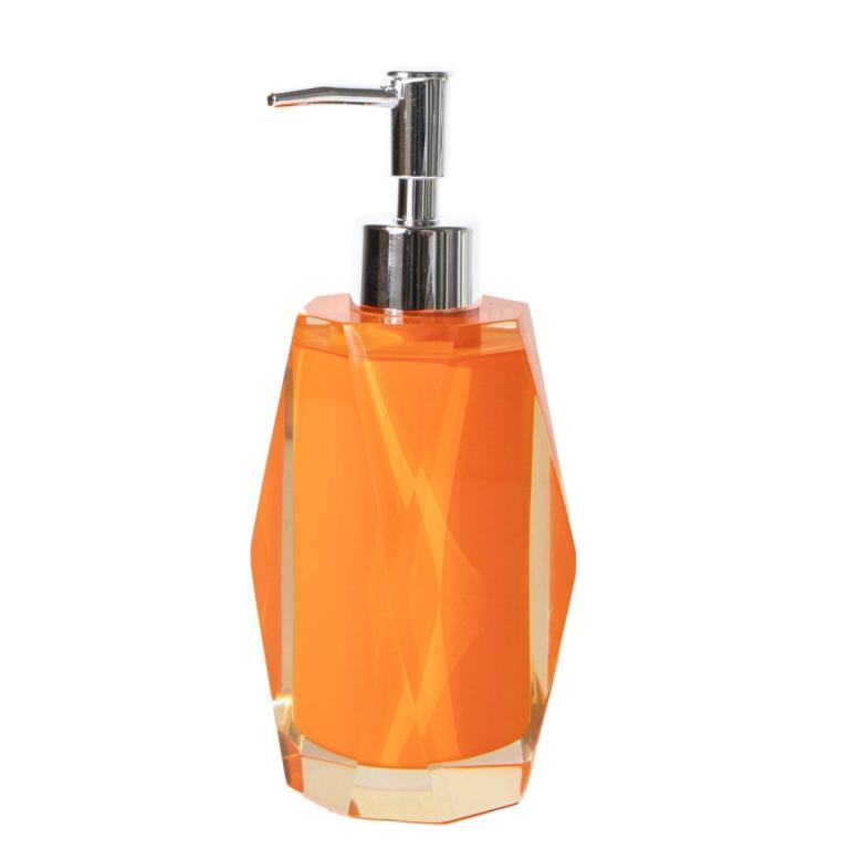 Faceted orange resin lotion pump with a diamond-like finish and a stainless steel dispenser top.