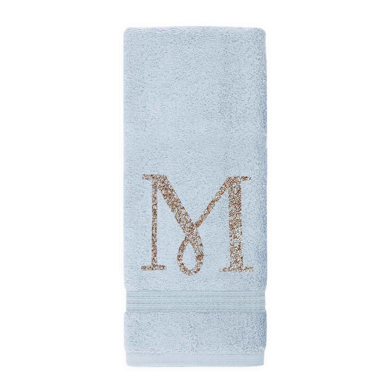 Aqua&#x20;cotton&#x20;terry&#x20;hand&#x20;towel&#x20;with&#x20;a&#x20;sparkling&#x20;rhinestone&#x20;monogram&#x20;&quot;M&quot;&#x20;and&#x20;a&#x20;textured&#x20;border&#x20;at&#x20;the&#x20;bottom.