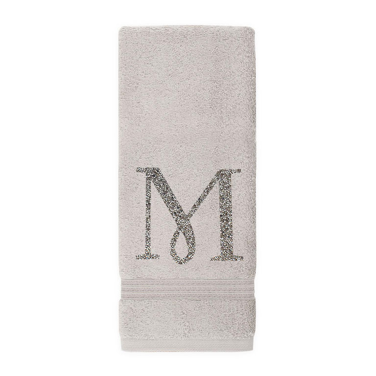 Gray&#x20;plush&#x20;cotton&#x20;terry&#x20;hand&#x20;towel&#x20;with&#x20;a&#x20;sparkling&#x20;rhinestone&#x20;monogram&#x20;&quot;M&quot;&#x20;and&#x20;a&#x20;textured&#x20;stripe&#x20;at&#x20;the&#x20;bottom.