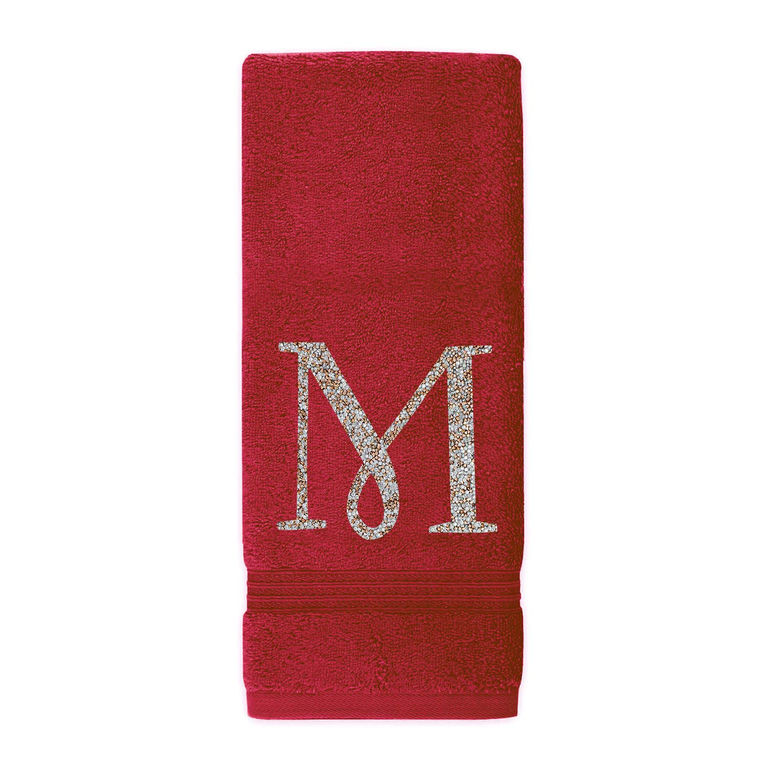 Red plush cotton terry hand towel with a sparkling rhinestone monogram "M" and decorative ribbed trim at the bottom.