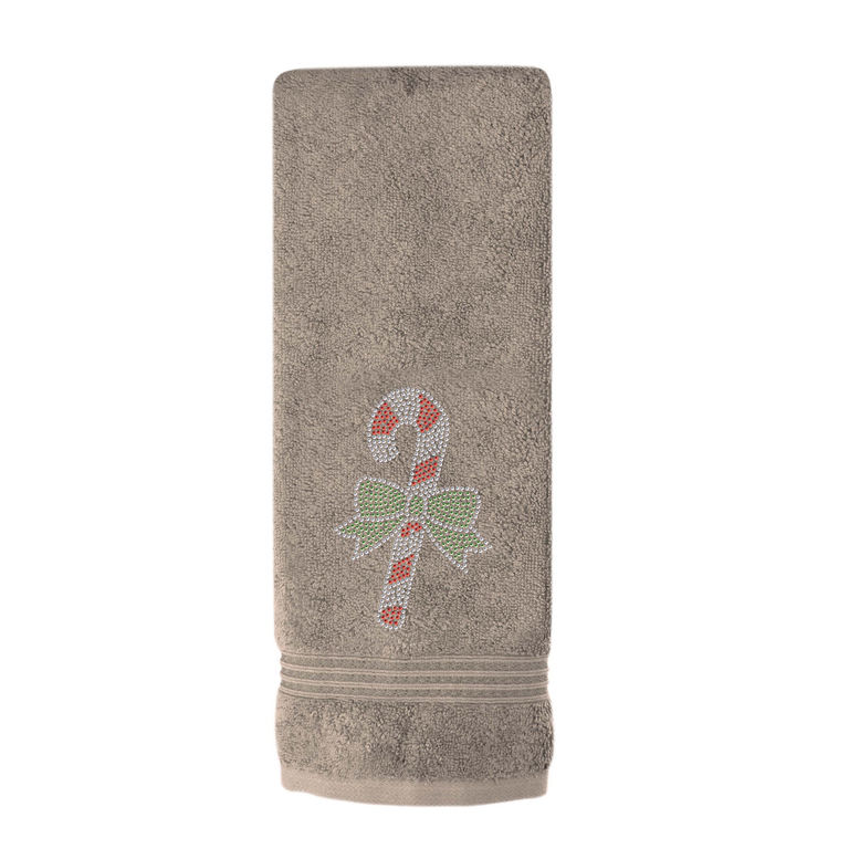 Taupe hand towel with a textured surface featuring a rhinestone candy cane design and green bow embellishment.