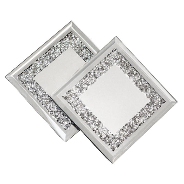 Square crystal coasters with mirrored centers embellished with clear rhinestone borders featuring a foam bottom for surface protection.