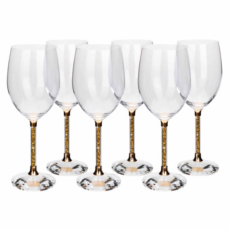 Clear crystal wine glass with a gold stem featuring sparkling rhinestones a gold base and a faceted clear glass foot.