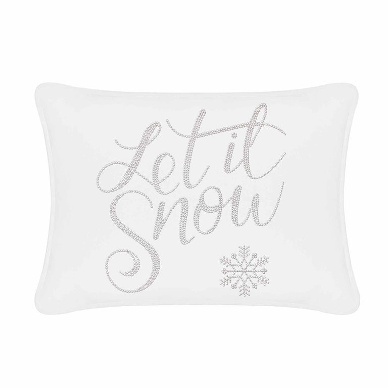 White velvet pillow featuring "Let it Snow" in silver rhinestones with a snowflake design on one side.