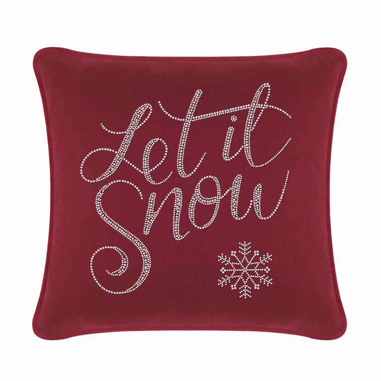 Burgundy velvet pillow featuring "Let it Snow" in glass rhinestones and a snowflake design on a plush surface.
