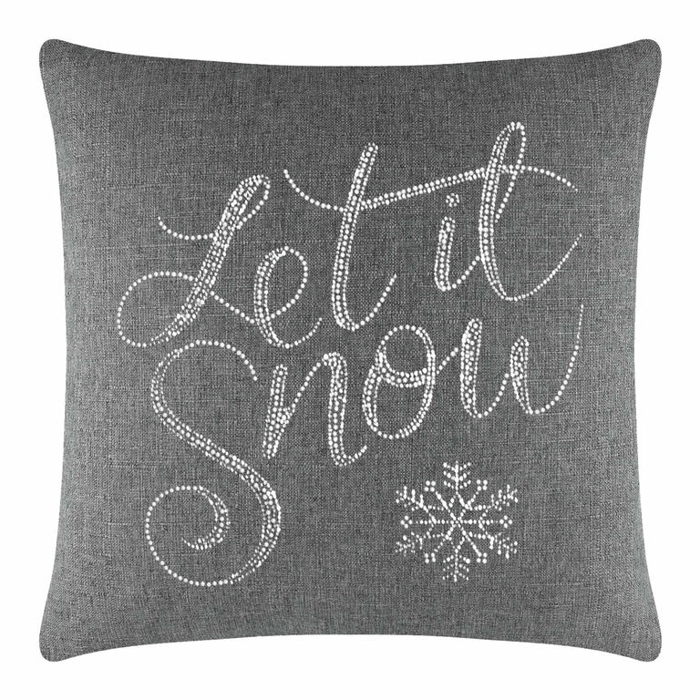 Gray&#x20;square&#x20;pillow&#x20;featuring&#x20;&quot;Let&#x20;it&#x20;Snow&quot;&#x20;in&#x20;glass&#x20;rhinestones&#x20;with&#x20;a&#x20;snowflake&#x20;design&#x20;on&#x20;a&#x20;textured&#x20;fabric&#x20;surface.