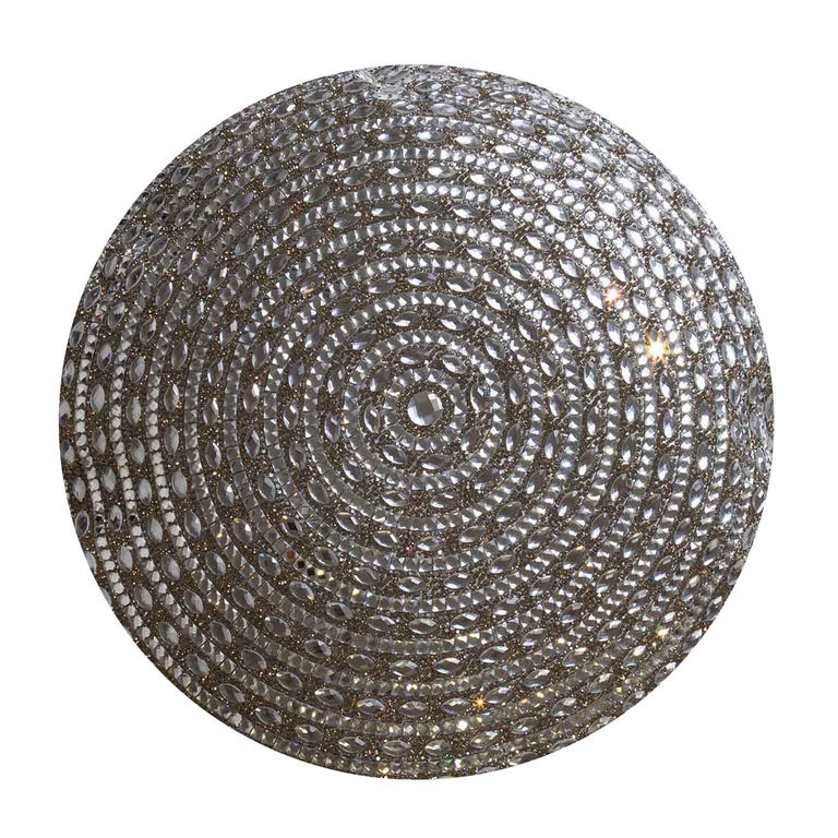 Round pillow covered in silver rhinestones arranged in concentric circles on a plush velvet base.