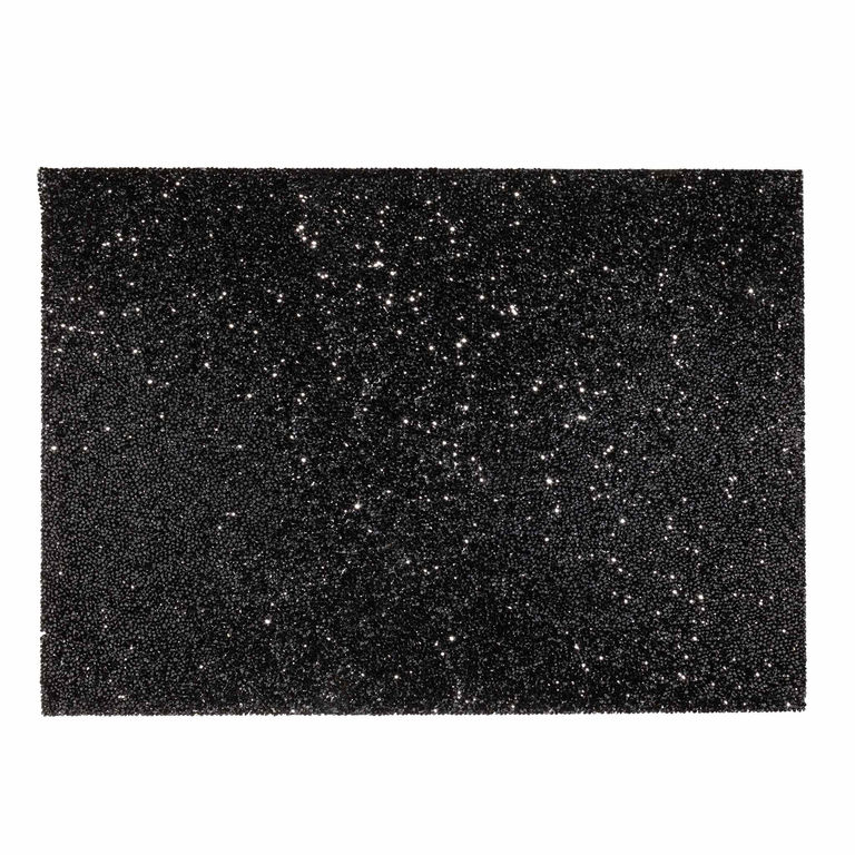 Black rectangular placemat with a textured surface embellished with sparkling rhinestones throughout.