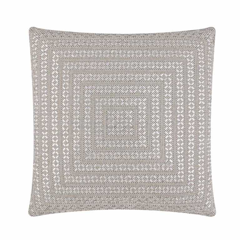 Square pillow with a silver velvet backing embellished with intricate rhinestone patterns forming a geometric design.