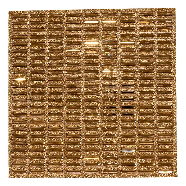 Gold rectangular placemat with a textured surface featuring rows of sparkling rhinestones and a grid pattern.