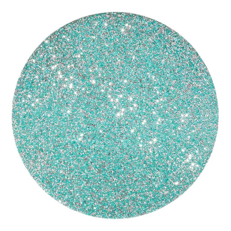 Round aqua placemat featuring a textured surface with vibrant rhinestones embedded throughout.