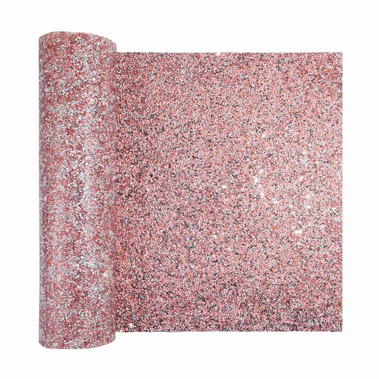 Pink table runner with a shimmering textured surface featuring sparkling rhinestones in various colors.