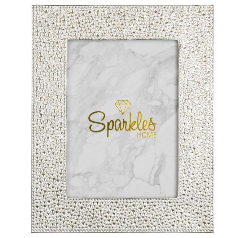 Silver picture frame adorned with glass rhinestones featuring a marble-patterned background and a gold logo.