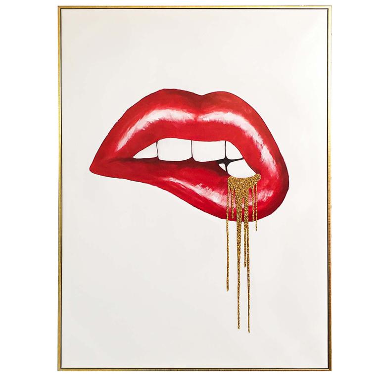 Red lips with gold dripping embellishments set against a white background framed in a metallic gold frame.