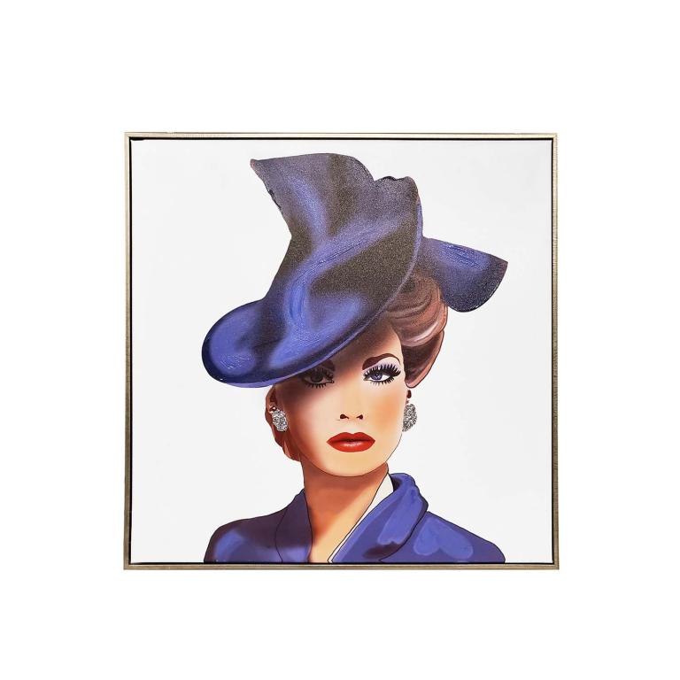 A framed canvas art piece featuring a woman with a large blue hat red lips and diamond earrings on a white background.