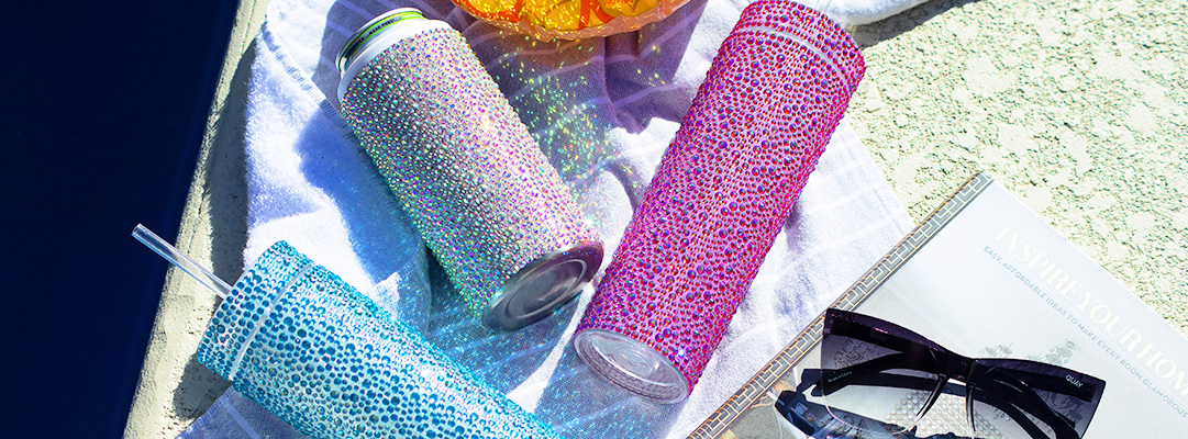 Colorful&amp;&#x23;x20&#x3B;rhinestone-wrapped&amp;&#x23;x20&#x3B;tumblers&amp;&#x23;x20&#x3B;in&amp;&#x23;x20&#x3B;blue,&amp;&#x23;x20&#x3B;pink,&amp;&#x23;x20&#x3B;and&amp;&#x23;x20&#x3B;turquoise&amp;&#x23;x20&#x3B;lying&amp;&#x23;x20&#x3B;on&amp;&#x23;x20&#x3B;white&amp;&#x23;x20&#x3B;towel&amp;&#x23;x20&#x3B;beside&amp;&#x23;x20&#x3B;pool&amp;&#x23;x20&#x3B;with&amp;&#x23;x20&#x3B;sunglasses