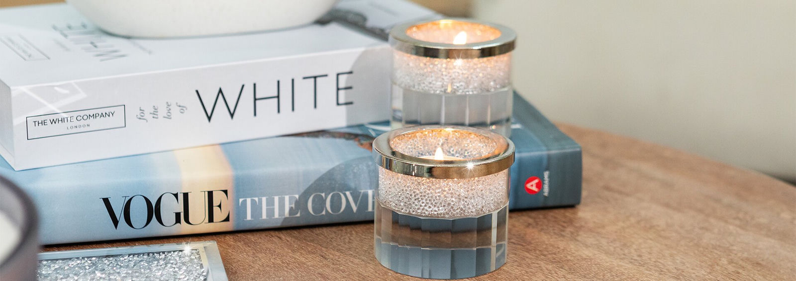 pair&amp;&#x23;x20&#x3B;of&amp;&#x23;x20&#x3B;rhinestone&amp;&#x23;x20&#x3B;tealight&amp;&#x23;x20&#x3B;holders&amp;&#x23;x20&#x3B;on&amp;&#x23;x20&#x3B;wood&amp;&#x23;x20&#x3B;table&amp;&#x23;x20&#x3B;with&amp;&#x23;x20&#x3B;white&amp;&#x23;x20&#x3B;decor&amp;&#x23;x20&#x3B;books&amp;&#x23;x20&#x3B;and&amp;&#x23;x20&#x3B;silver&amp;&#x23;x20&#x3B;tray