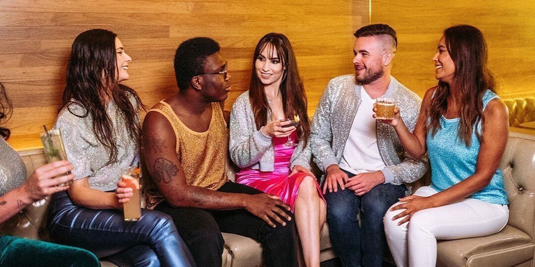 group&amp;&#x23;x20&#x3B;of&amp;&#x23;x20&#x3B;glamorous&amp;&#x23;x20&#x3B;guests&amp;&#x23;x20&#x3B;enjoying&amp;&#x23;x20&#x3B;cocktails&amp;&#x23;x20&#x3B;in&amp;&#x23;x20&#x3B;rhinestone-decorated&amp;&#x23;x20&#x3B;summer&amp;&#x23;x20&#x3B;lounge&amp;&#x23;x20&#x3B;area