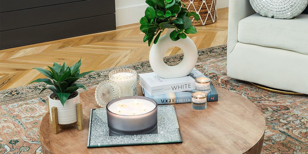 Round&amp;&#x23;x20&#x3B;wooden&amp;&#x23;x20&#x3B;coffee&amp;&#x23;x20&#x3B;table&amp;&#x23;x20&#x3B;styled&amp;&#x23;x20&#x3B;with&amp;&#x23;x20&#x3B;large&amp;&#x23;x20&#x3B;candle&amp;&#x23;x20&#x3B;on&amp;&#x23;x20&#x3B;sparkly&amp;&#x23;x20&#x3B;silver&amp;&#x23;x20&#x3B;tray,&amp;&#x23;x20&#x3B;stack&amp;&#x23;x20&#x3B;of&amp;&#x23;x20&#x3B;coffee&amp;&#x23;x20&#x3B;table&amp;&#x23;x20&#x3B;books&amp;&#x23;x20&#x3B;including&amp;&#x23;x20&#x3B;