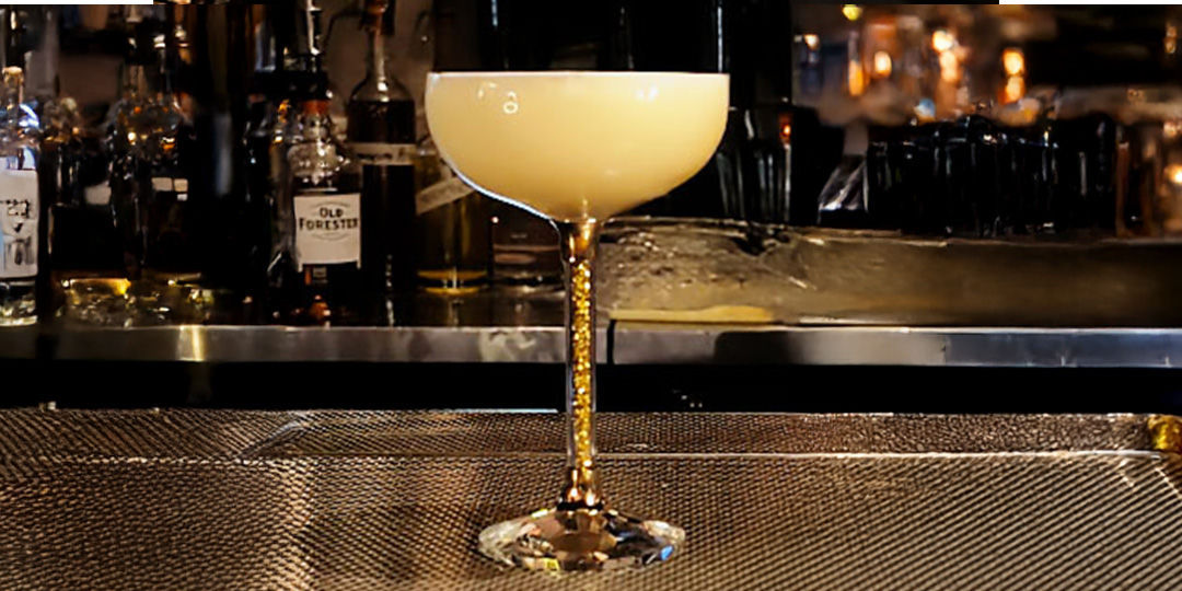 Amaretto&amp;&#x23;x20&#x3B;sour&amp;&#x23;x20&#x3B;cocktail&amp;&#x23;x20&#x3B;in&amp;&#x23;x20&#x3B;sparkling&amp;&#x23;x20&#x3B;stem&amp;&#x23;x20&#x3B;coupe&amp;&#x23;x20&#x3B;glass&amp;&#x23;x20&#x3B;with&amp;&#x23;x20&#x3B;frothy&amp;&#x23;x20&#x3B;egg&amp;&#x23;x20&#x3B;white&amp;&#x23;x20&#x3B;top