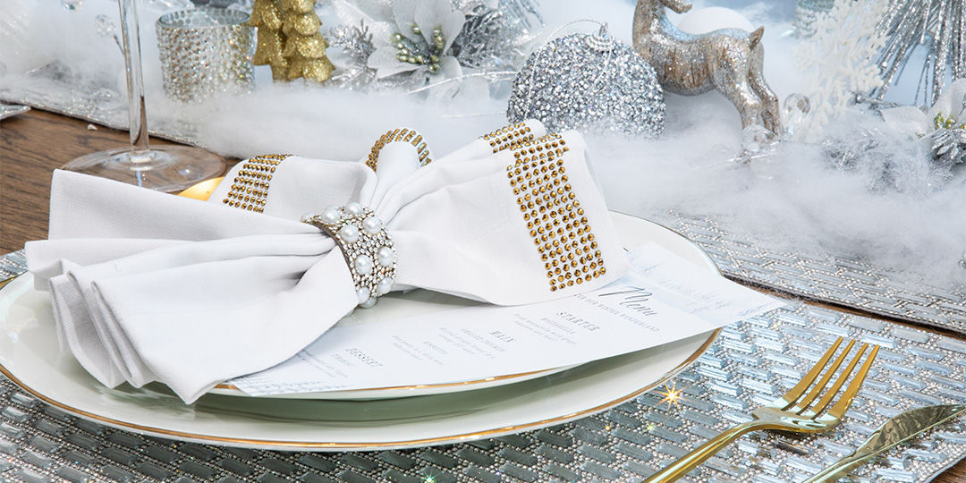 Holiday&amp;&#x23;x20&#x3B;appetizer&amp;&#x23;x20&#x3B;spread&amp;&#x23;x20&#x3B;on&amp;&#x23;x20&#x3B;sparkling&amp;&#x23;x20&#x3B;charger&amp;&#x23;x20&#x3B;plates&amp;&#x23;x20&#x3B;with&amp;&#x23;x20&#x3B;festive&amp;&#x23;x20&#x3B;garnishes&amp;&#x23;x20&#x3B;and&amp;&#x23;x20&#x3B;candles