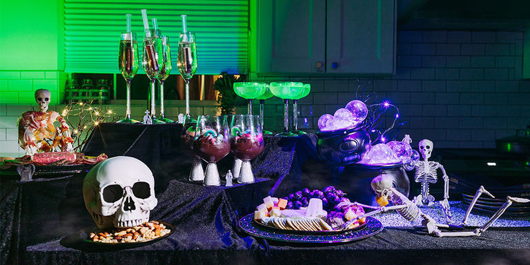 Spooky&amp;&#x23;x20&#x3B;Halloween&amp;&#x23;x20&#x3B;party&amp;&#x23;x20&#x3B;table&amp;&#x23;x20&#x3B;with&amp;&#x23;x20&#x3B;skeleton&amp;&#x23;x20&#x3B;decorations,&amp;&#x23;x20&#x3B;crystal&amp;&#x23;x20&#x3B;glasses,&amp;&#x23;x20&#x3B;cocktails,&amp;&#x23;x20&#x3B;and&amp;&#x23;x20&#x3B;purple&amp;&#x23;x20&#x3B;lighting&amp;&#x23;x20&#x3B;effects