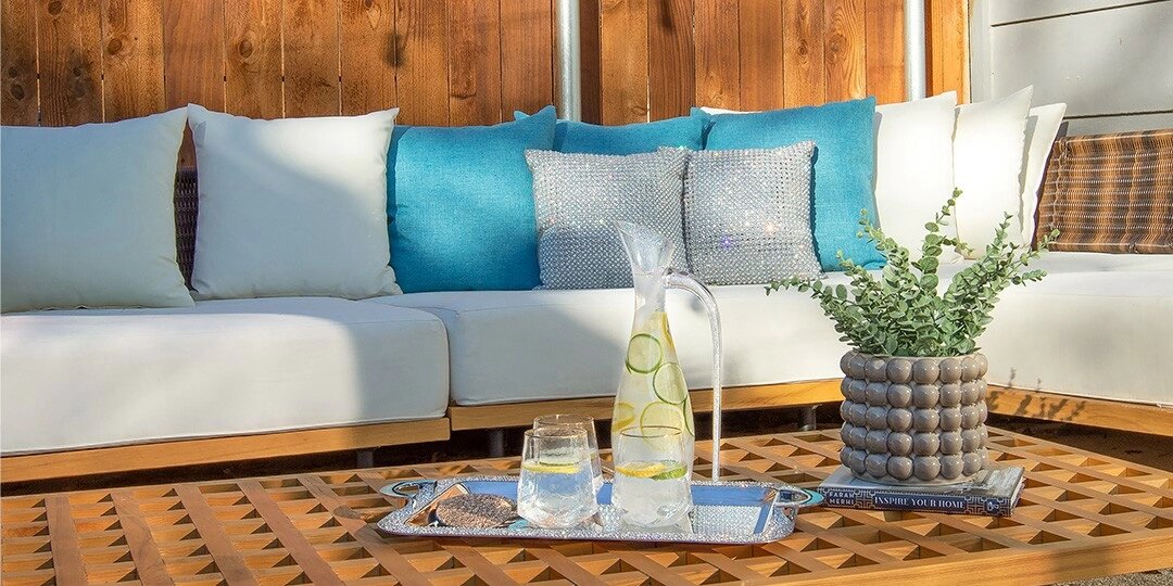 outdoor&amp;&#x23;x20&#x3B;patio&amp;&#x23;x20&#x3B;with&amp;&#x23;x20&#x3B;aqua&amp;&#x23;x20&#x3B;glam&amp;&#x23;x20&#x3B;pillows,&amp;&#x23;x20&#x3B;mirrored&amp;&#x23;x20&#x3B;tray,&amp;&#x23;x20&#x3B;and&amp;&#x23;x20&#x3B;lemon-infused&amp;&#x23;x20&#x3B;water&amp;&#x23;x20&#x3B;pitcher