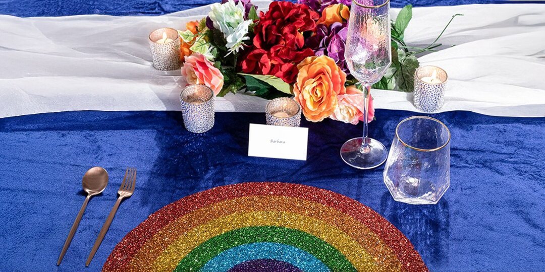 glam&amp;&#x23;x20&#x3B;Pride&amp;&#x23;x20&#x3B;tablescape&amp;&#x23;x20&#x3B;with&amp;&#x23;x20&#x3B;glitter&amp;&#x23;x20&#x3B;rainbow&amp;&#x23;x20&#x3B;placemat,&amp;&#x23;x20&#x3B;blue&amp;&#x23;x20&#x3B;velvet&amp;&#x23;x20&#x3B;tablecloth,&amp;&#x23;x20&#x3B;gold&amp;&#x23;x20&#x3B;flatware,&amp;&#x23;x20&#x3B;and&amp;&#x23;x20&#x3B;rainbow&amp;&#x23;x20&#x3B;florals