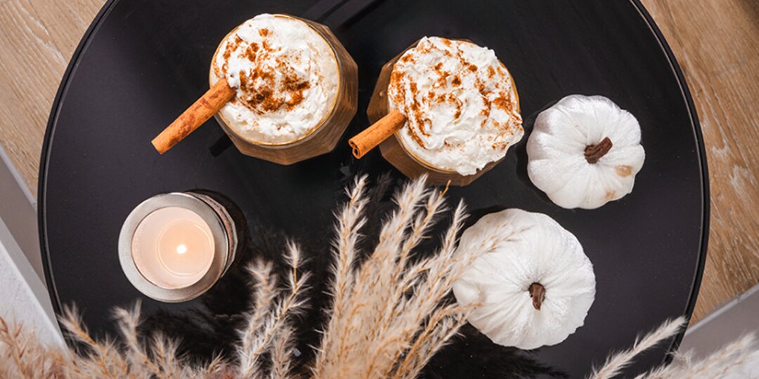 Top&amp;&#x23;x20&#x3B;view&amp;&#x23;x20&#x3B;of&amp;&#x23;x20&#x3B;pumpkin&amp;&#x23;x20&#x3B;spice&amp;&#x23;x20&#x3B;lattes&amp;&#x23;x20&#x3B;with&amp;&#x23;x20&#x3B;whipped&amp;&#x23;x20&#x3B;cream&amp;&#x23;x20&#x3B;and&amp;&#x23;x20&#x3B;cinnamon&amp;&#x23;x20&#x3B;beside&amp;&#x23;x20&#x3B;decorative&amp;&#x23;x20&#x3B;white&amp;&#x23;x20&#x3B;pumpkins
