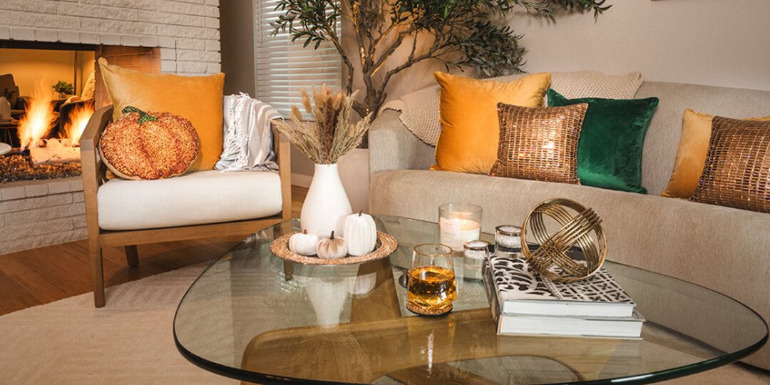 cozy&amp;&#x23;x20&#x3B;glam&amp;&#x23;x20&#x3B;living&amp;&#x23;x20&#x3B;room&amp;&#x23;x20&#x3B;setup&amp;&#x23;x20&#x3B;with&amp;&#x23;x20&#x3B;rhinestone&amp;&#x23;x20&#x3B;pillows,&amp;&#x23;x20&#x3B;pumpkin&amp;&#x23;x20&#x3B;accents,&amp;&#x23;x20&#x3B;and&amp;&#x23;x20&#x3B;glass&amp;&#x23;x20&#x3B;coffee&amp;&#x23;x20&#x3B;table