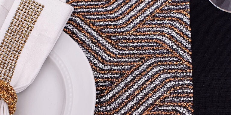Close-up of rhinestone Art Deco table runner with gold and silver chevron pattern