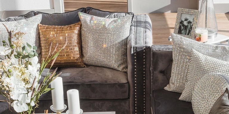 glass rhinestone pillows styled in metallic glam living room
