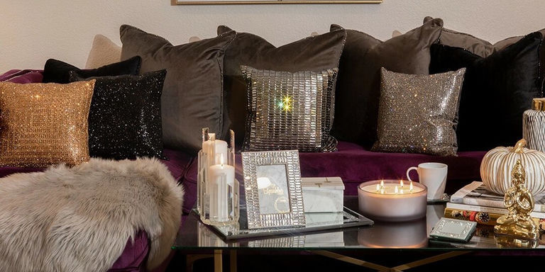 metallic decor accents on glam console table and mirror