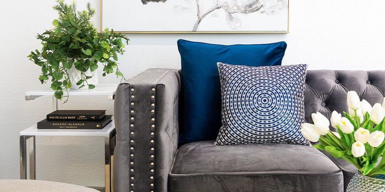charcoal velvet sofa with blue velvet and rhinestone patterned accent pillows