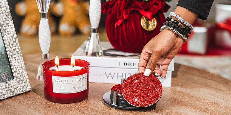 Red rhinestone coaster from Madison Avenue set with candle and books