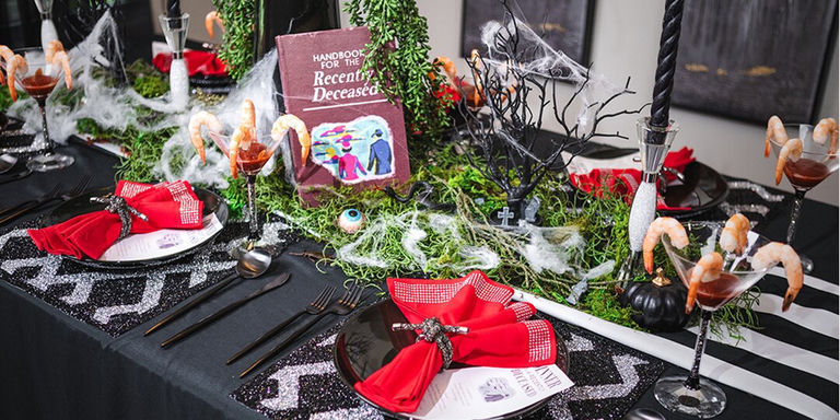 Glam Beetlejuice-inspired Halloween table with haunted centerpiece and rhinestone accents